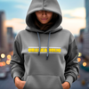 Female with a light gray bella canvas hoodie, Craneaholic DTG printed design on the front of the hoodie with a city scape back ground