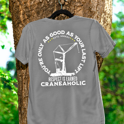 Gray craneaholic shirt hanging on a tree on a black hanger