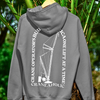 Gray bellas canvas crane operator hoodie hanging on a palm tree outdoors show casing the fabric and DTG crane operator blue collar worker design on the back