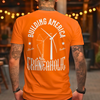 A man with tattoes wearing a orange building america craneaholic renewable energy t shirt with DTG printing process at a diner