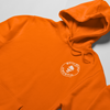 Close up view mock up of orange high vise hoodie with building america design DTG printed on the front right corner